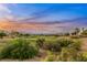 Stunning aerial view of a golf course community at sunset at 4541 Largo Cantata St, Las Vegas, NV 89135