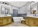 Elegant bathroom with double vanities and a soaking tub at 4541 Largo Cantata St, Las Vegas, NV 89135