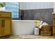 Bathroom with a freestanding tub and block glass window at 4541 Largo Cantata St, Las Vegas, NV 89135