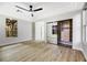 Bright bedroom with wood floors, a ceiling fan and mirrored closet at 4541 Largo Cantata St, Las Vegas, NV 89135