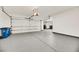 Garage with epoxy flooring, overhead storage and extra space at 4541 Largo Cantata St, Las Vegas, NV 89135