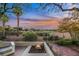 Patio with fire pit overlooking a golf course community at 4541 Largo Cantata St, Las Vegas, NV 89135