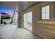 Bright patio with seating area and view into the dining room at 4541 Largo Cantata St, Las Vegas, NV 89135