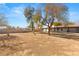 Backyard with mature trees and a large, open space at 4840 Conough Ln, Las Vegas, NV 89149