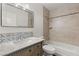 Updated bathroom with marble vanity and tile shower/tub combo at 4840 Conough Ln, Las Vegas, NV 89149