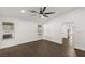 Bright bedroom with ceiling fan and dark brown tile floor at 4840 Conough Ln, Las Vegas, NV 89149