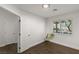 Bright bedroom with window, plant, and dark brown tile floor at 4840 Conough Ln, Las Vegas, NV 89149