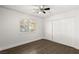 Spacious bedroom with wood-look tile floor and large closet at 4840 Conough Ln, Las Vegas, NV 89149