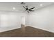 Spacious bedroom with ceiling fan and dark brown tile floors at 4840 Conough Ln, Las Vegas, NV 89149