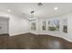 Bright dining room with hardwood floors and a modern chandelier at 4840 Conough Ln, Las Vegas, NV 89149