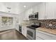 Modern kitchen with stainless steel appliances and wine cooler at 4840 Conough Ln, Las Vegas, NV 89149