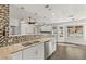 Kitchen with granite countertops, double sink, and tile backsplash at 4840 Conough Ln, Las Vegas, NV 89149