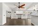 Bright living room with dark tile floors and a ceiling fan at 4840 Conough Ln, Las Vegas, NV 89149