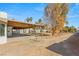 Covered patio and expansive backyard with desert landscaping at 4840 Conough Ln, Las Vegas, NV 89149