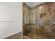 Large walk-in shower with multi-colored tile and glass enclosure at 4840 Conough Ln, Las Vegas, NV 89149