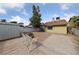 Spacious backyard featuring a wooden deck and a brick patio, perfect for outdoor gatherings and relaxation at 504 Crony Ave, Henderson, NV 89011