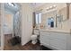 Bathroom featuring a shower, toilet, and vanity with modern fixtures at 504 Crony Ave, Henderson, NV 89011