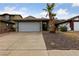 Single story house with attached garage and desert landscaping at 504 Crony Ave, Henderson, NV 89011