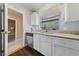 Bright kitchen with white cabinets and stainless steel appliances at 504 Crony Ave, Henderson, NV 89011