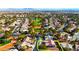 Aerial view of single-story home with tile roof, located near golf course at 5305 Singing Hills Dr, Las Vegas, NV 89130