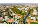 Aerial view of single-story home with tile roof, near golf course at 5305 Singing Hills Dr, Las Vegas, NV 89130