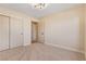 Well-lit bedroom with carpeted floors and sliding closet doors at 5305 Singing Hills Dr, Las Vegas, NV 89130