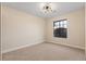 Spacious bedroom with carpeted floors and a large window at 5305 Singing Hills Dr, Las Vegas, NV 89130