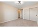 Spacious bedroom with neutral walls and carpet at 5305 Singing Hills Dr, Las Vegas, NV 89130