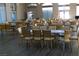 Large room with numerous tables and gold chairs, suitable for events at 5305 Singing Hills Dr, Las Vegas, NV 89130