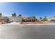 Single-story house with a landscaped yard and a two-car garage at 5305 Singing Hills Dr, Las Vegas, NV 89130