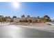 Single story home with landscaping and driveway at 5305 Singing Hills Dr, Las Vegas, NV 89130