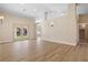 Bright living room with hardwood floors and French doors at 5305 Singing Hills Dr, Las Vegas, NV 89130