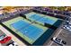 Two tennis courts with blue surface, surrounded by fencing and parking at 5305 Singing Hills Dr, Las Vegas, NV 89130