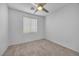 Well-lit bedroom featuring neutral wall and carpeting at 5445 Tallulah Falls St, North Las Vegas, NV 89081