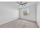 Bright bedroom with ceiling fan and neutral carpeting at 5445 Tallulah Falls St, North Las Vegas, NV 89081