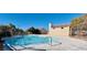 Community pool with surrounding patio and fence at 5445 Tallulah Falls St, North Las Vegas, NV 89081