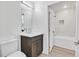 Modern bathroom with dark gray vanity, white countertop, and a toilet at 59 E Agate Ave # 406, Las Vegas, NV 89123