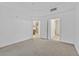 Spacious carpeted bedroom with access to other rooms at 59 E Agate Ave # 406, Las Vegas, NV 89123