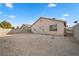 Large open backyard featuring a block wall and partial view of the home's exterior at 610 Roberta Alecia Ave, North Las Vegas, NV 89031