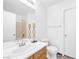 Bathroom featuring a single sink vanity, a mirror, toilet, and a tub-shower combination at 610 Roberta Alecia Ave, North Las Vegas, NV 89031