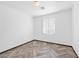 Bedroom with herringbone floors, natural light, and neutral wall color at 610 Roberta Alecia Ave, North Las Vegas, NV 89031