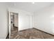 Neutral bedroom featuring herringbone floors, closet, and access to other rooms at 610 Roberta Alecia Ave, North Las Vegas, NV 89031