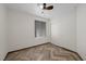 This bedroom features a ceiling fan, window with blinds, and a closet at 610 Roberta Alecia Ave, North Las Vegas, NV 89031