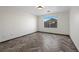 Well-lit bedroom featuring herringbone floors and a view to the outside at 610 Roberta Alecia Ave, North Las Vegas, NV 89031