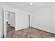 Bright bedroom showcases herringbone floors, ample natural light, and closet storage at 610 Roberta Alecia Ave, North Las Vegas, NV 89031