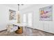 Cozy dining area featuring a stylish table and chairs with art pieces and a modern light fixture at 610 Roberta Alecia Ave, North Las Vegas, NV 89031