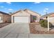 Charming single-story home featuring a two-car garage and low-maintenance desert landscaping at 610 Roberta Alecia Ave, North Las Vegas, NV 89031