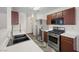 Well-lit kitchen features stainless steel appliances, double bowl sink, and plentiful countertop space at 610 Roberta Alecia Ave, North Las Vegas, NV 89031