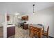 Bright kitchen with stainless steel appliances and a casual dining area with a wooden table at 610 Roberta Alecia Ave, North Las Vegas, NV 89031