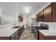 Well-lit kitchen with stainless steel appliances, ample counter space, and modern design at 610 Roberta Alecia Ave, North Las Vegas, NV 89031